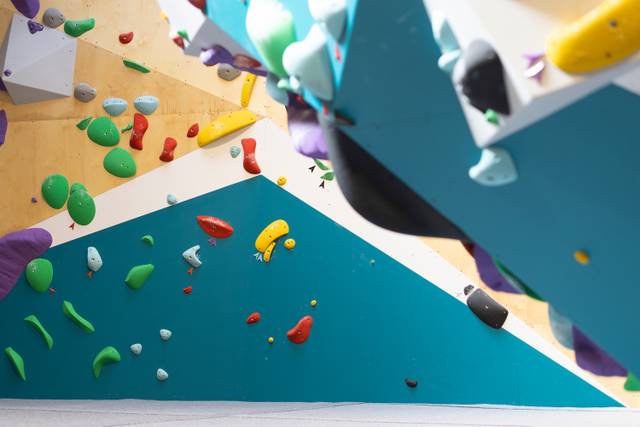 Climbers on the overhang wall at BoulderRyn