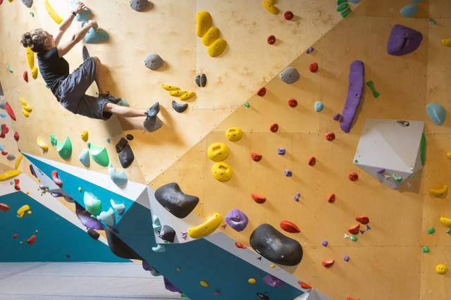 Climbers on the overhang wall at BoulderRyn