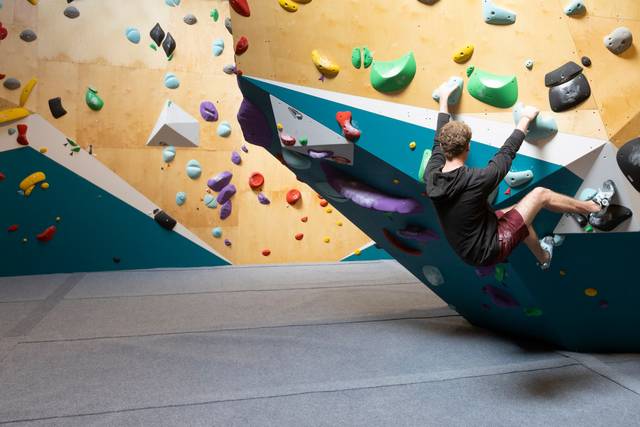 Climbers on the overhang wall at BoulderRyn