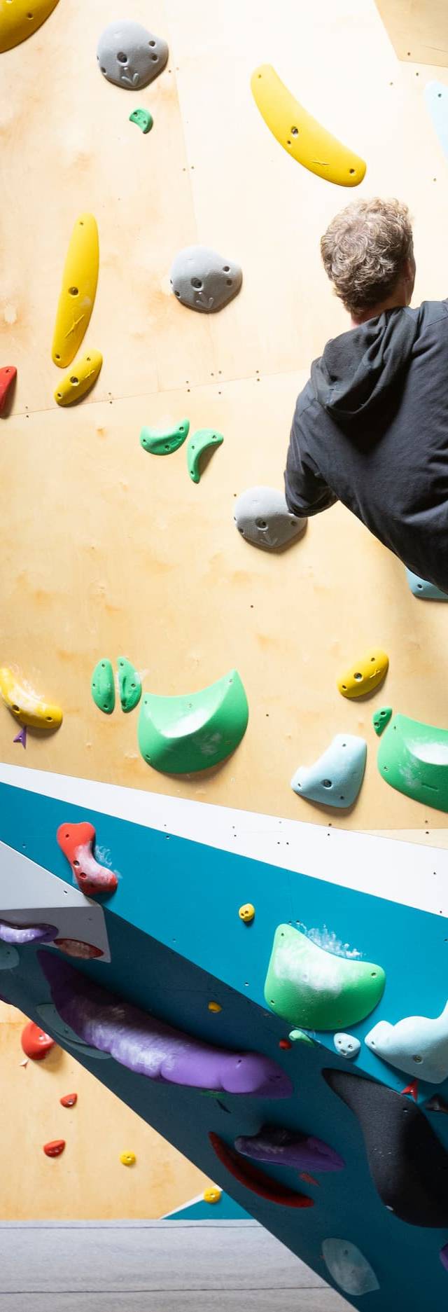 Climbers on the overhang wall at BoulderRyn