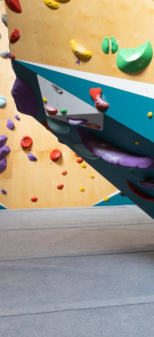Climbers on the overhang wall at BoulderRyn